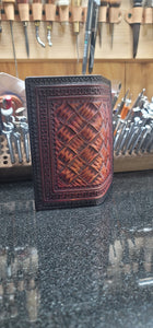 Mahogany and black roper wallet with hand cut basket pattern